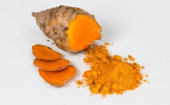 half cut turmeric with turmeric powder where the second half would be